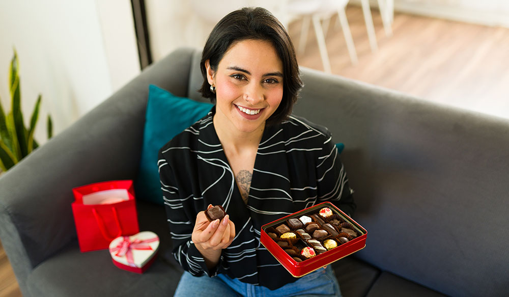 woman with box valentine chocolates
