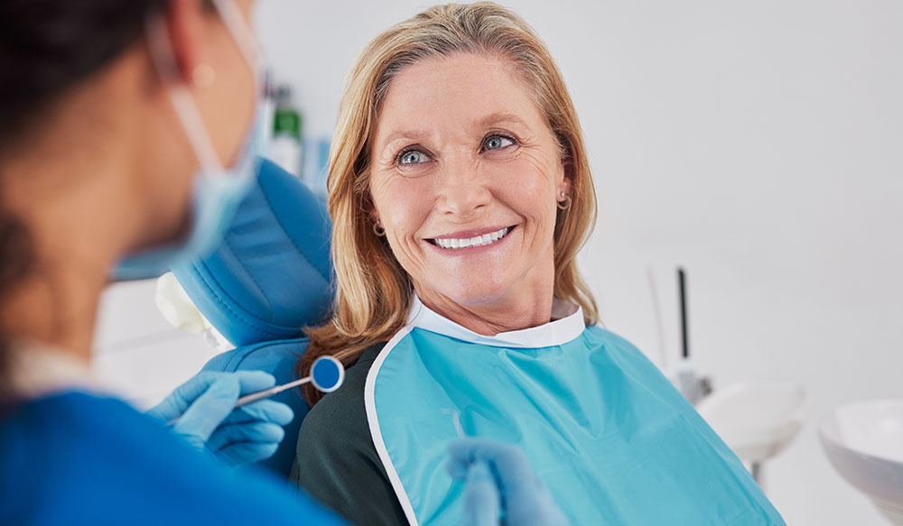 older woman dentures dentist